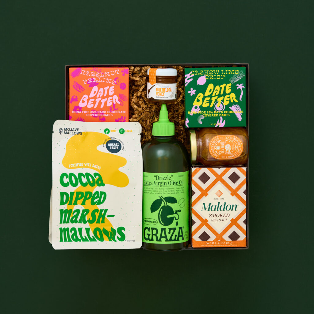 food and snack gift box on a dark green background